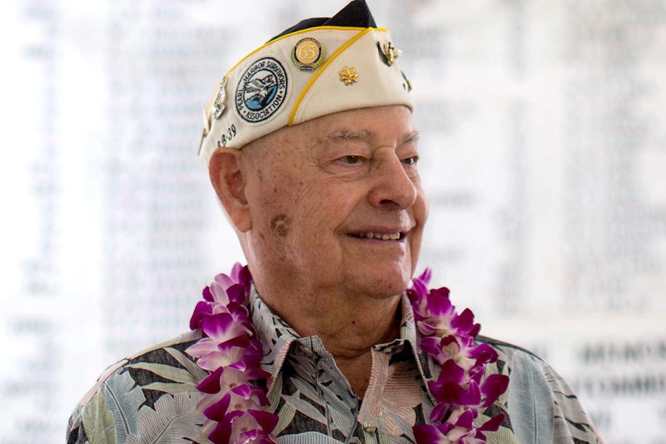 <p>Kent Nishimura/Getty</p> U.S.S. Arizona survivor Lou Conter stands in the shrine room of the U.S.S. Arizona memorial at the 71st Annual Memorial Ceremony commemorating the WWII Attack On Pearl Harbor at the World War 2 Valor in the Pacific National Monument December 7, 2012 in Pearl Harbor, Hawaii.