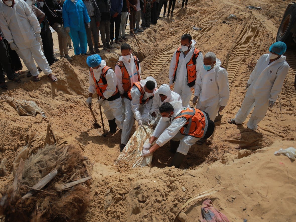 Workers uncovered more bodies on Monday from a mass grave at the Nasser medical complex in Khan Younis, in the southern Gaza Strip. The United Nations human rights chief has called for an investigation into the deaths and destruction of the hospital site. (Mohamed El Saife - image credit)