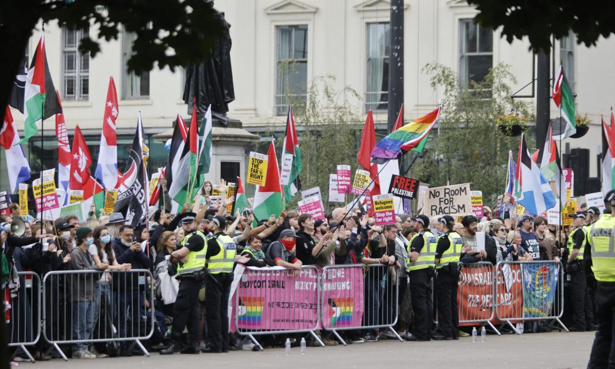 <span>The opposing rallies were separated by lines of police and metal barriers.</span><span>Photograph: Murdo MacLeod/The Guardian</span>