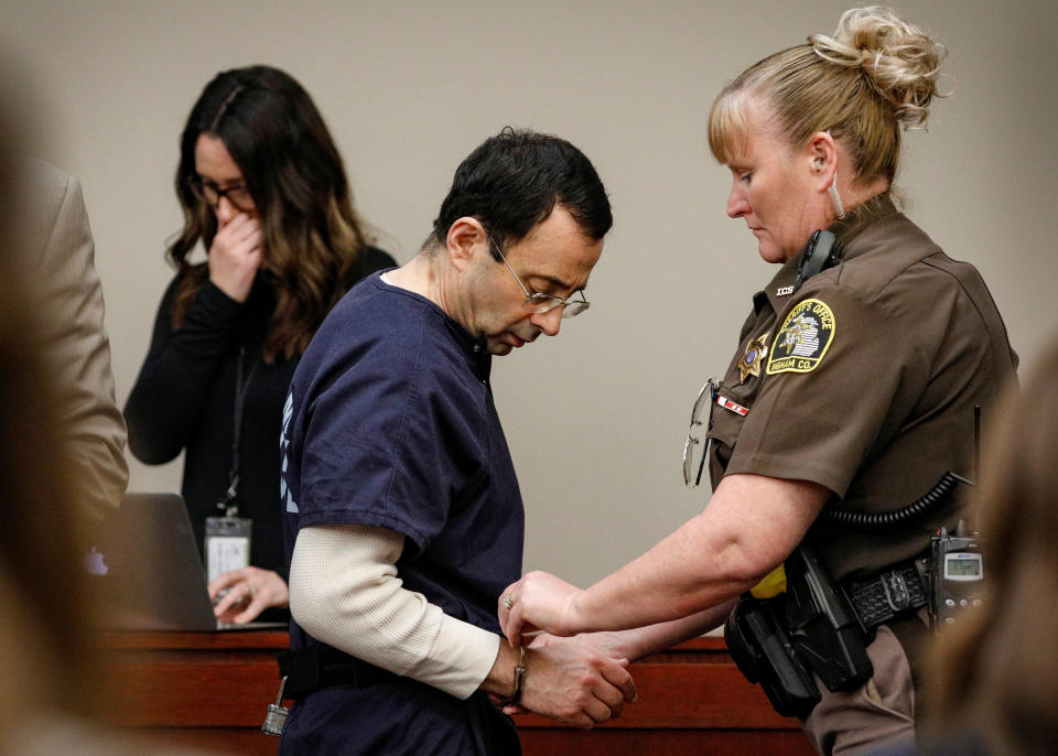 Nassar is handcuffed in the courtroom at the end of a day of testimony during his sentencing hearing. (Photo: Brendan McDermid/Reuters)