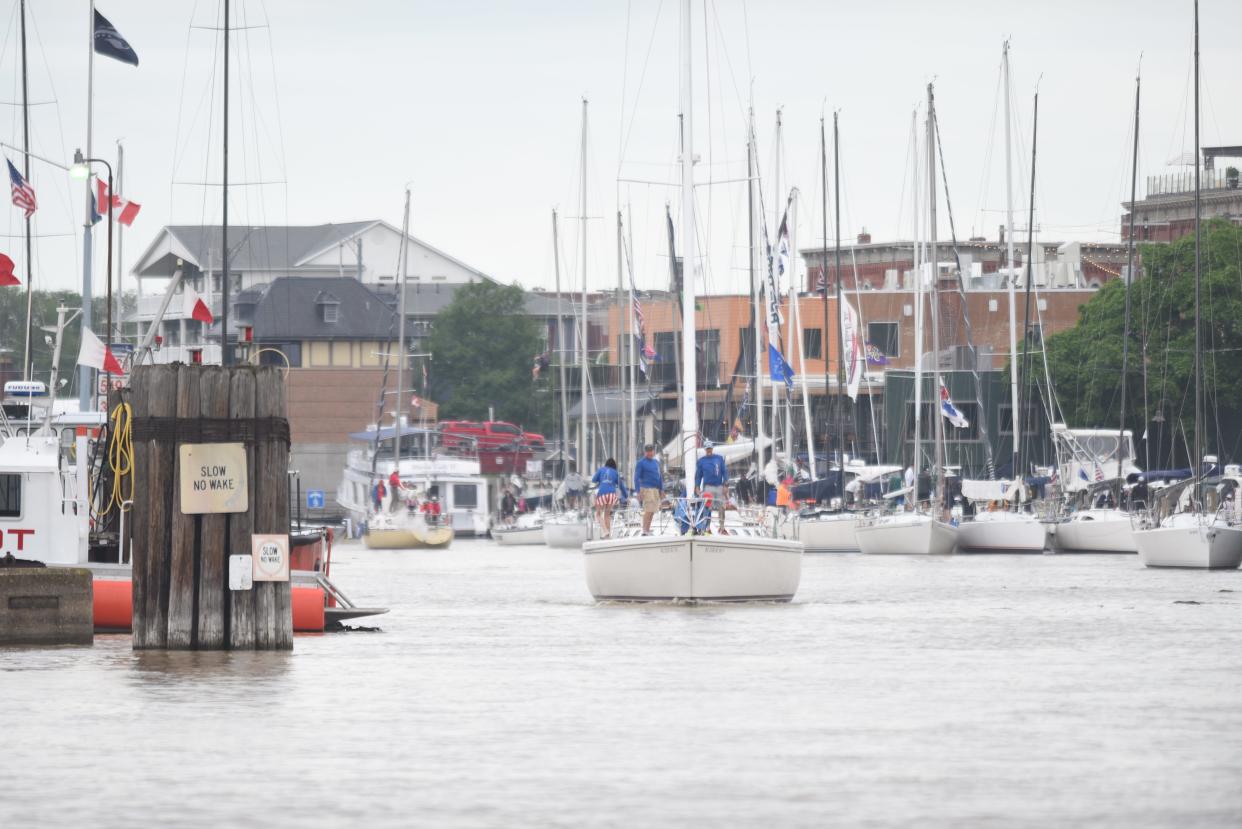 A sailboat exits the Black River toward the start of the Port Huron-to-Mackinac Island Sailboat Race on Saturday, July 15, 2023.