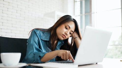 <span class="caption">Could quiet quitting be for you?</span> <span class="attribution"><a class="link " href="https://www.shutterstock.com/image-photo/portrait-bored-young-asian-woman-typing-1928197478" rel="nofollow noopener" target="_blank" data-ylk="slk:1st footage / Shutterstock;elm:context_link;itc:0;sec:content-canvas">1st footage / Shutterstock</a></span>