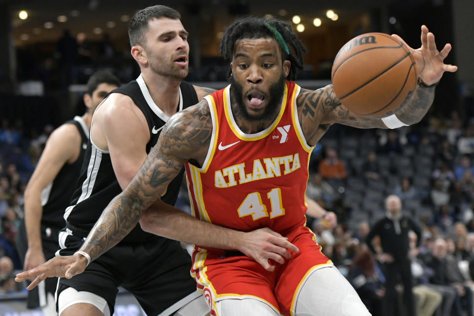 Atlanta Hawks forward Saddiq Bey (41) is defended by Memphis Grizzlies guard John Konchar during the first half of an NBA basketball game Friday, March 8, 2024, in Memphis, Tenn. (AP Photo/Brandon Dill)