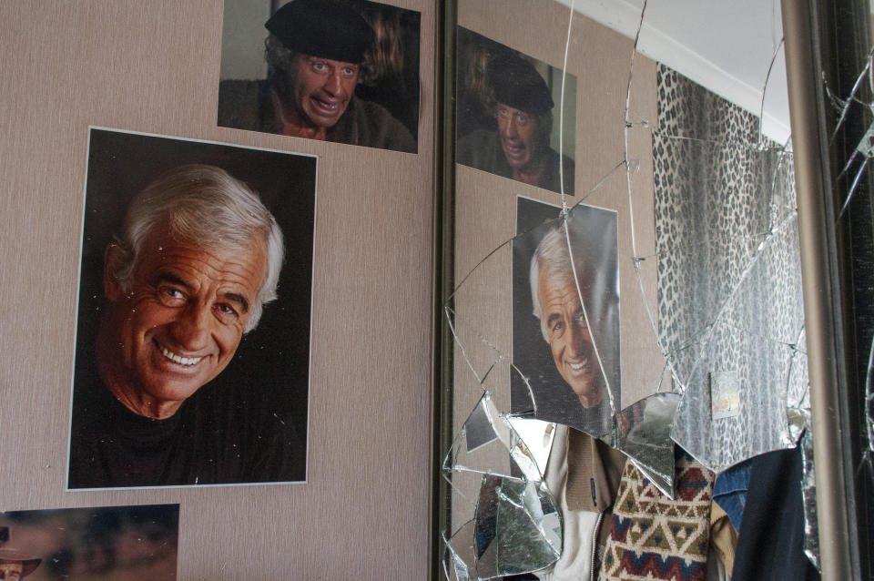 Portraits of French actor Jean-Paul Belmondo on the wall in a destroyed apartment, in a building damaged by shelling, in Kharkiv, Ukraine, Sunday, March 13, 2022. (Andrew Marienko/AP)