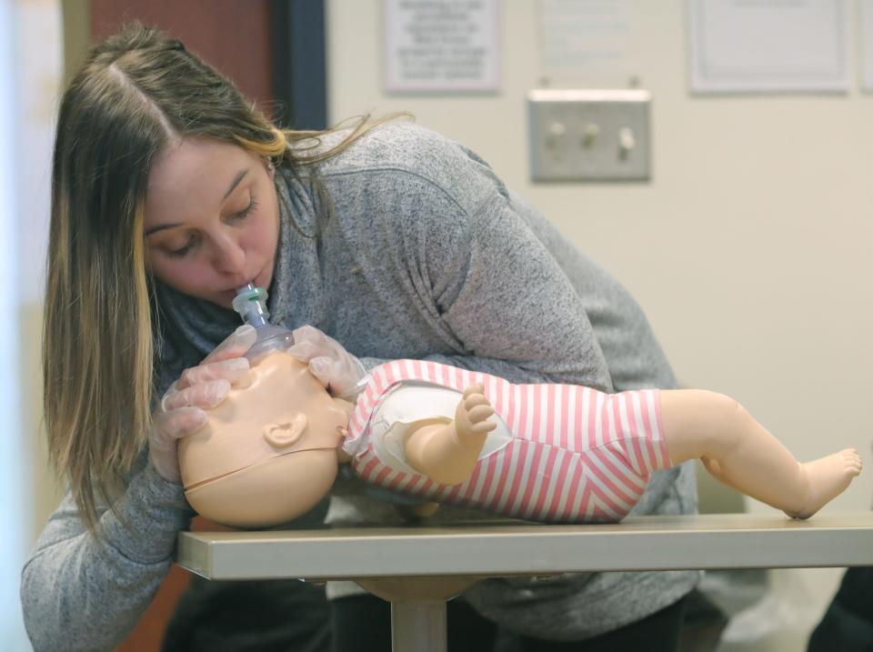 Maddie Boone of Stow practices how to perform CPR for a baby during a class Wednesday at the Summit County Red Cross in Akron.