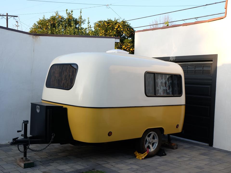 A travel trailer outside.