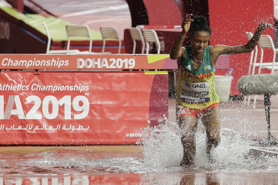 FILE - Ethiopia's Zerfe Wondemagegn competes during the women's 3,000 meters steeplechase heats at the World Athletics Championships in Doha, Qatar, Friday, Sept. 27, 2019. Wondemagegn, who reached the 3,000-meter steeplechase final at the Tokyo Olympics, and narrowly missed the world championship podium last year, has been banned for five years for doping after testing positive for two banned substances. Wondemagegn admitted breaking anti-doping rules after samples she gave flagged up traces of testosterone and another substance, EPO, which can help athletes' blood transport more oxygen, an Athletics Integrity Unit ruling published Monday, April 22, 2024, said. (AP Photo/Nariman El-Mofty, File)