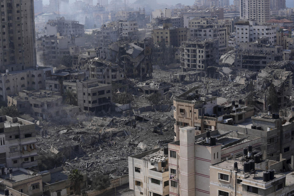 FILE - Destruction from Israeli aerial bombardment is seen in Gaza City, on Oct. 11, 2023. After 11 weeks of war in Gaza, the Israeli military campaign against Hamas now sits among the deadliest and most destructive in history. The Palestinian death toll is approaching 20,000 and satellite data shows that one-third of structures across the tiny enclave have been destroyed. (AP Photo/Adel Hana, File)