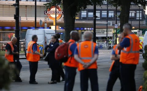 Transport officials outside Southgate Tube station - Credit: Tolga Akmen/LNP 