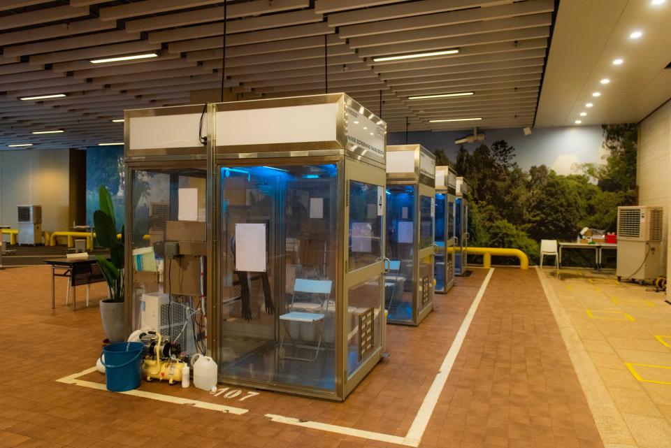 People can get tested at swab booths, or while seated in their vehicles at One Farrer Hotel as part of a drive-through testing initiative. (PHOTO: Temasek Foundation)