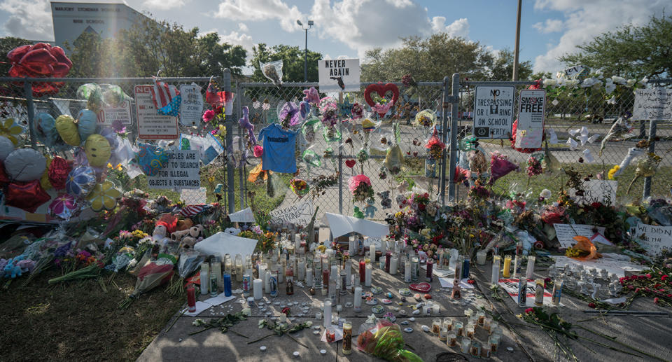 A wall of tributes left outside Marjory Stoneman Douglas High School Source: Getty