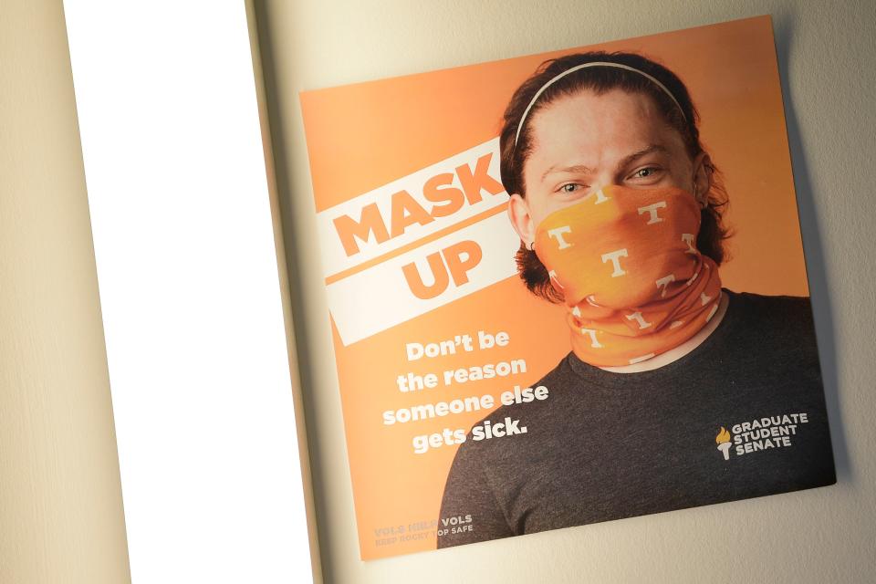 A sign in the student union asks visitors to wear face masks on the first day of the spring semester at the University of Tennessee in Knoxville on Jan. 20, 2021.