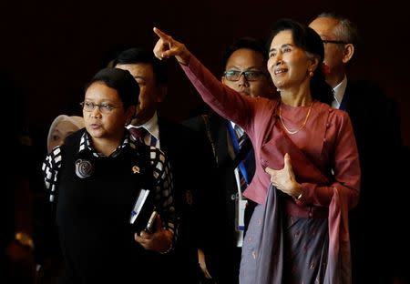 Indonesia Foreign Minister Retno Marsudi and Myanmar State Counsellor Aung San Suu Kyi walk after they attended ASEAN Foreign Minister Meeting on Rohingya issue in Sedona hotel at Yangon, Myanmar December 19, 2016. REUTERS/Soe Zeya Tun