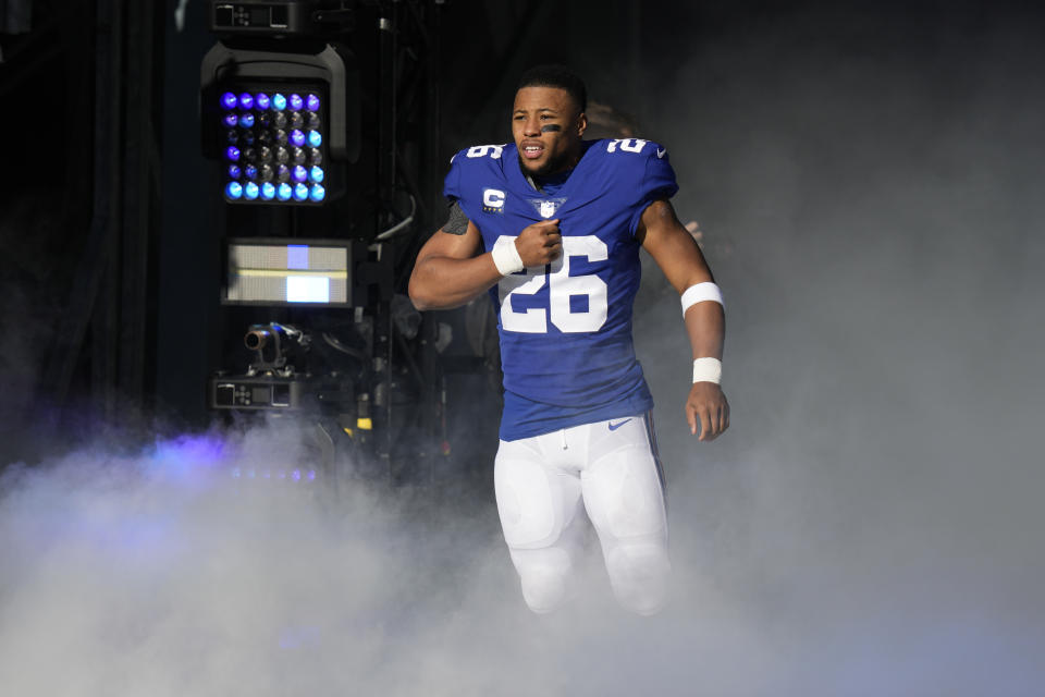 New York Giants running back Saquon Barkley (26) reacts as he is introduced before an NFL football game against the Indianapolis Colts, Sunday, Jan. 1, 2023, in East Rutherford, N.J. (AP Photo/Seth Wenig)