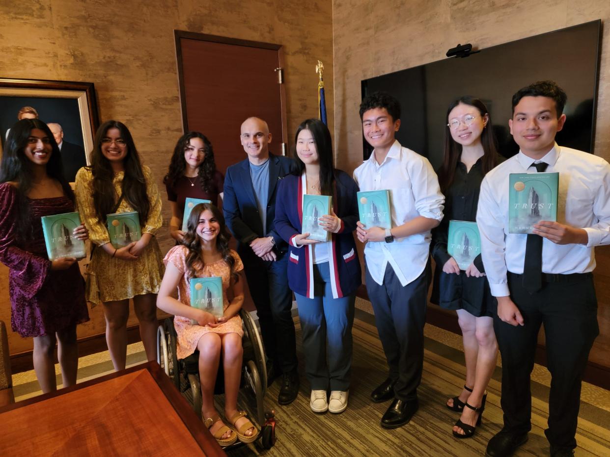 Xavier College Preparatory High School students pose with Trust author Hernan Diaz.