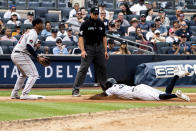 New York Yankees' Tim Locastro slides into third base during the fourth inning of a baseball game against the Boston Red Sox, Sunday, July 17, 2022, in New York. (AP Photo/Julia Nikhinson)