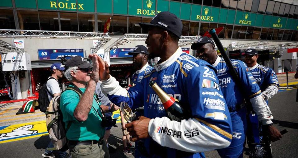 The Hendrick Motorsports No. 24 Garage 56 crew celebrates with fans on pit road after winning the pit stop challenge at the 24 Hours at Le Mans