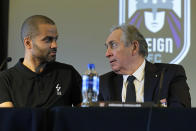 OL Groupe's Gerard Houllier, right, talks with former NBA basketball star Tony Parker, left, Thursday, Dec. 19, 2019, during a news conference to announce that OL Groupe, the parent company of Olympique Lyonnais, is buying the National Women's Soccer League's Reign FC team in a transaction expected to close in January 2020. Parker will be a minority owner of the team and Reign FC will continue to play its home games at Cheney Stadium, the venue it shares with the Triple-A minor league baseball team the Tacoma Rainiers. (AP Photo/Ted S. Warren)