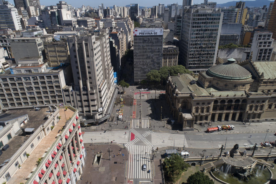 A building is covered by the Portuguese message: "Coronavirus: take precaution" over empty streets in downtown Sao Paulo, Brazil, Monday, March 23, 2020. (AP Photo/Andre Penner)