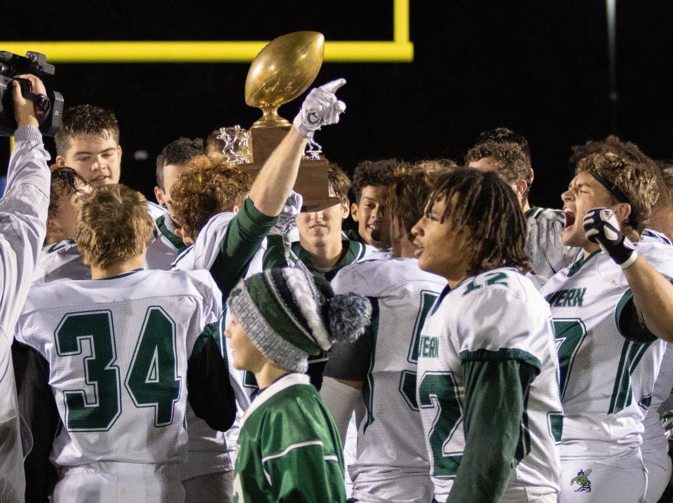 Malvern raise the Hornet Trophy after defeating East Canton and winning the Inter-Valley Conference North Division championship Friday, Oct. 22, 2021.