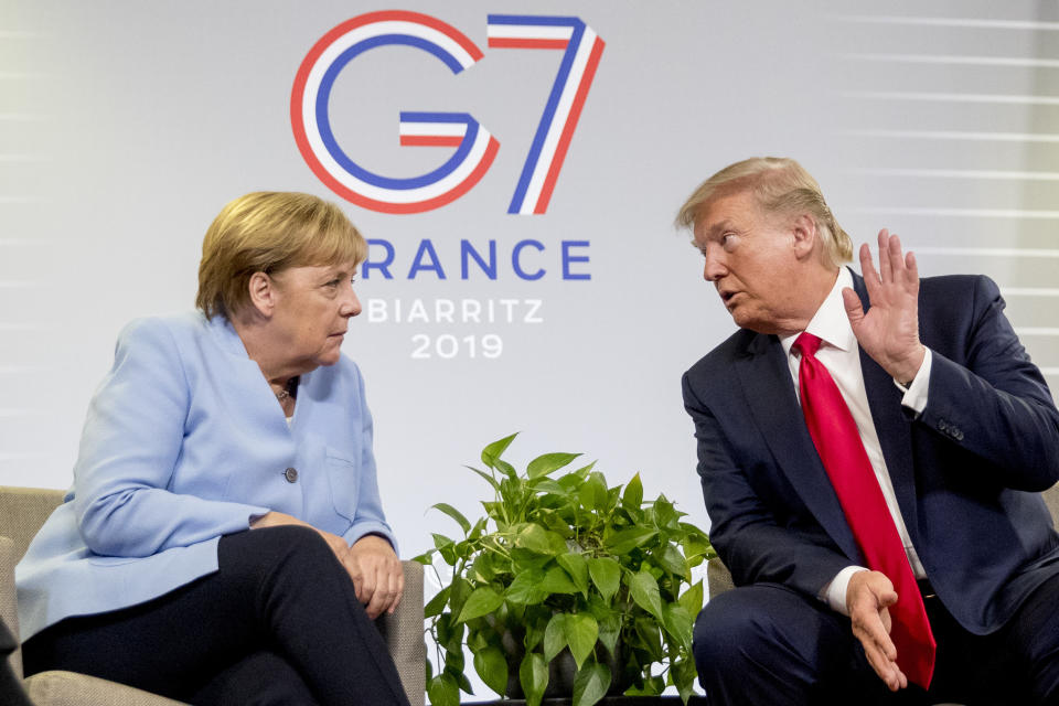 U.S. President Donald Trump and German Chancellor Angela Merkel participate in a bilateral meeting at the G-7 summit in Biarritz, France, Monday, Aug. 26, 2019. (AP Photo/Andrew Harnik)