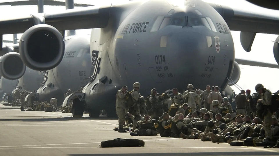 U.S. Army paratroopers prepare to board an Air Force C-17 Globemaster III in Italy, during Operation Iraqi Freedom, March 26, 2003. Nearly 1,000 