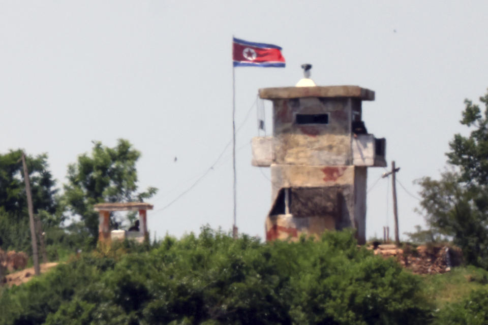 A North Korean flag flutters in the wind at a military guard post seen from Paju, South Korea, Tuesday, June 4, 2024. South Korea’s government approved the suspension of a contentious military agreement with North Korea on Tuesday, a step that would allow it to take tougher responses to North Korean provocations. (Kim In-chul/Yonhap via AP)