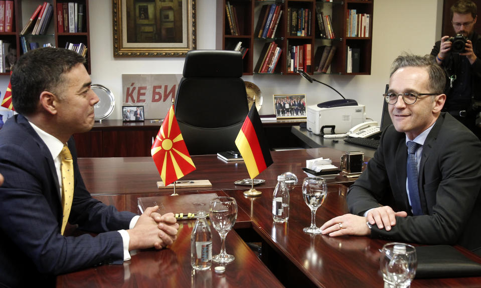 German Foreign Minister Heiko Maas, right, talks with his North Macedonia's counterpart Nikola Dimitrov, at the ministry of foreign affairs in Skopje, North Macedonia, on Wednesday, Nov. 13, 2019. Maas arrived Wednesday in Skopje to discuss bilateral relations after North Macedonia failed to open European Union membership talks last month. (AP Photo/Boris Grdanoski)