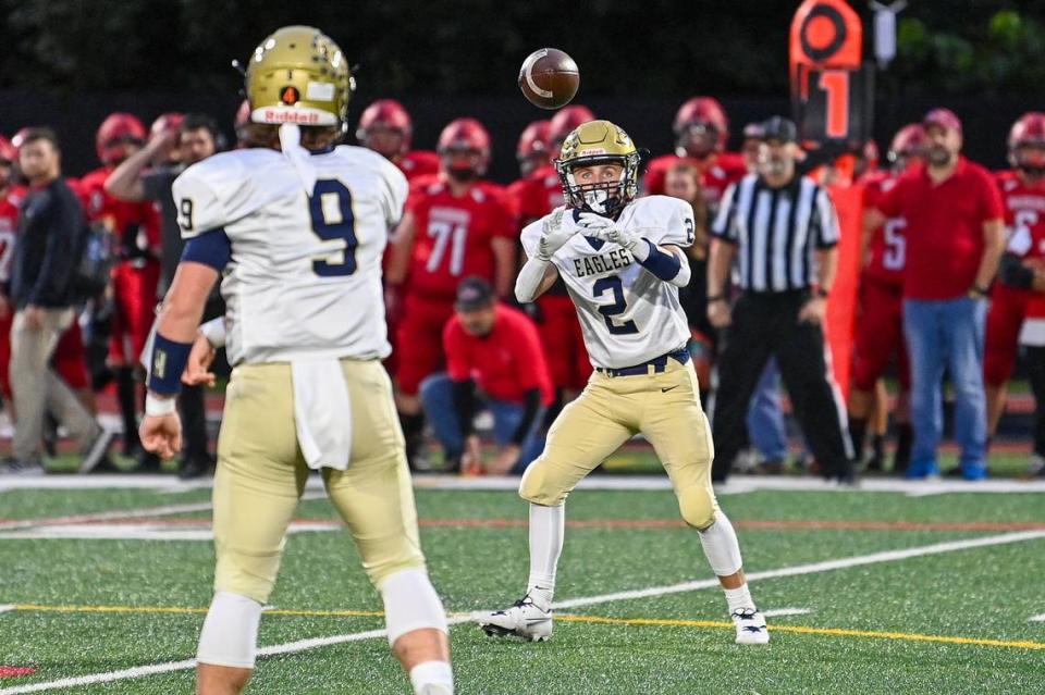 Bald Eagle Area’s Carson Nagle completes a pass to Kahale Burns during the Friday, Sept. 29, 2023 game against Bellefonte.