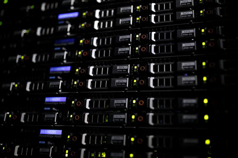 Lights illuminate rack servers inside the data center of Equinix in Pantin