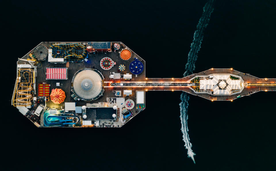 Matt Cooper's aerial picture shows a boat speeding underneath Brighton Pier in East Sussex, England.