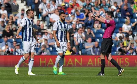 Britain Football Soccer - West Bromwich Albion v Southampton - Premier League - The Hawthorns - 8/4/17 West Bromwich Albion's Gareth McAuley and Matt Phillips look dejected as referee Chris Kavanagh gestures Reuters / Anthony Devlin Livepic