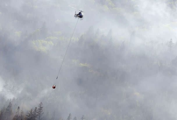 PHOTO: A helicopter drops water on the Tantallon wildfire, west of Halifax, Canada, May 29, 2023. (Nova Scotia Government via AFP/Getty Images)