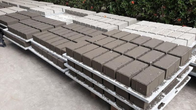 Bricks made of volcanic ash are laid out outside a brick-making facility in Binan, Laguna