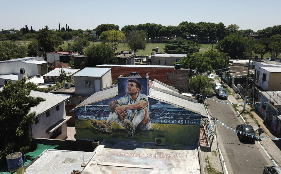 A mural of soccer player Lionel Messi covers the home where he lived in Rosario, Argentina, Wednesday, Dec. 14, 2022. (AP Photo/Rodrigo Abd)