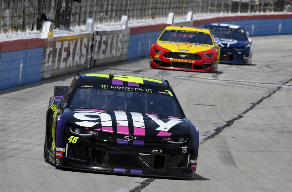 Driver Jimmie Johnson leads the field during a NASCAR Cup auto race at Texas Motor Speedway, Sunday, March 31, 2019, in Fort Worth, Texas. (AP Photo/Larry Papke)