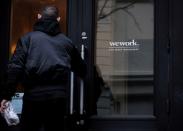 FILE PHOTO: FILE PHOTO: A man enters a WeWork co-working space in New York