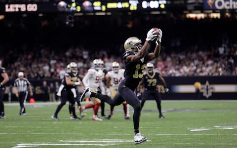 New Orleans Saints wide receiver Michael Thomas (13) pulls in a touchdown reception in the second half an NFL football game against the San Francisco 49ers in New Orleans - Credit: AP