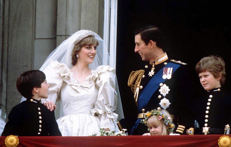 FILE PHOTO: Prince Charles and Princess Diana stand on the balcony of Buckingham Palace following their wedding at St. Pauls Cathedral