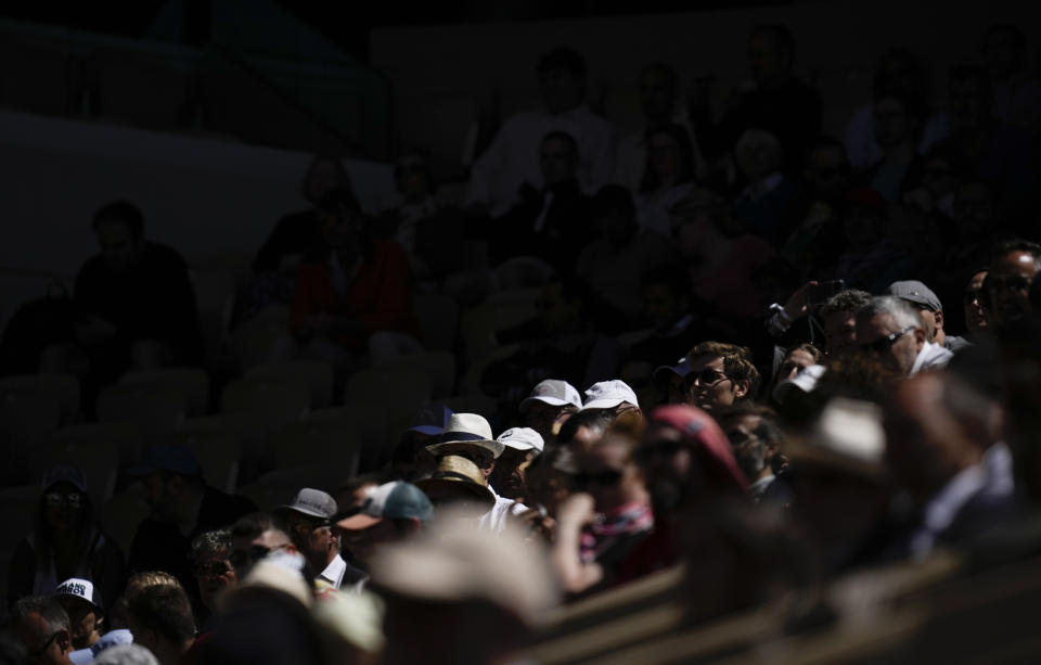 Spectators watch second round matches at the French Open tennis tournament in Roland Garros stadium in Paris, France, Wednesday, May 25, 2022. (AP Photo/Christophe Ena)