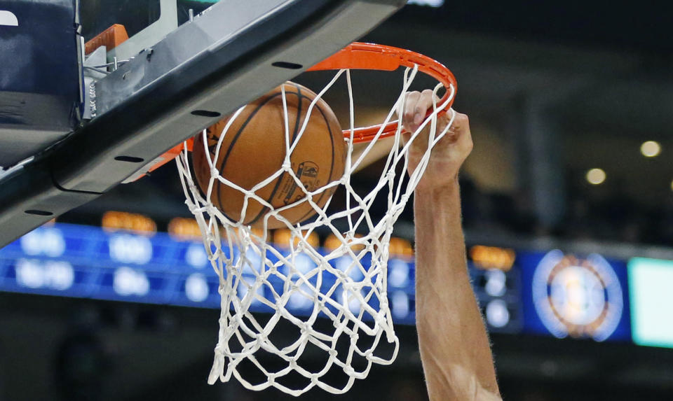 An announcer resigned after bashing a high schooler for dunking. (AP Photo/Rick Bowmer)