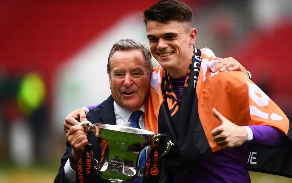 Presenter Jeff Stelling celebrates with Brad James of Hartlepool United and the Trophy following the Vanarama National League Play-Off Final match between Hartlepool United and Torquay United at Ashton Gate - Getty Images/Harry Trump