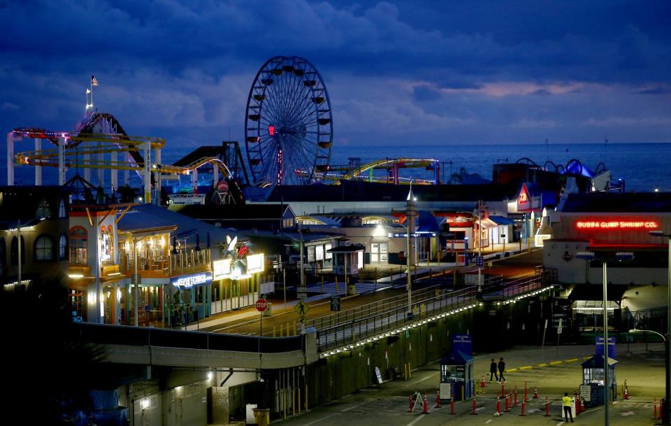 The lights are on but the Santa Monica Pier is closed to the public on March 19.