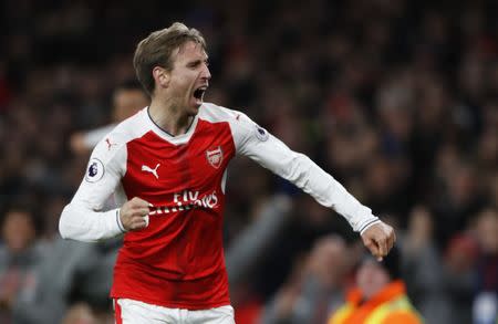 Britain Soccer Football - Arsenal v Leicester City - Premier League - Emirates Stadium - 26/4/17 Arsenal's Nacho Monreal celebrates after Leicester City's Robert Huth scores an own goal and the first goal for Arsenal Reuters / Stefan Wermuth