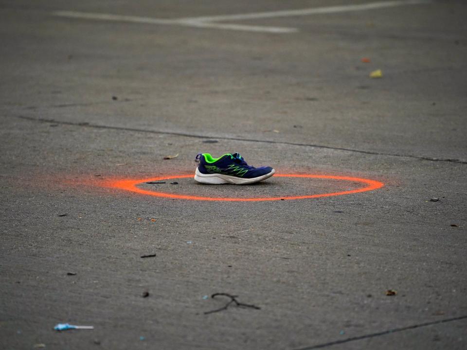 Shoes left at the scene where an SUV crashed into a crowd in Waukesha, Wisconsin.