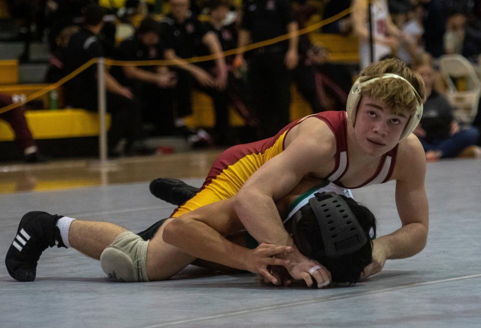 Isaiah Schaefer of Evansville Mater Dei and Marco Anderson of Evansville North compete in the 120-pound championship match of the 2023 IHSAA Wrestling Sectional tournament at Central High School in Evansville, Ind., Saturday afternoon, Jan. 28, 2023.