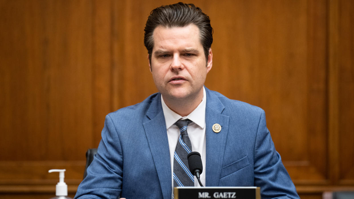 Rep. Matt Gaetz, brows furrowed, makes a point at the microphone.