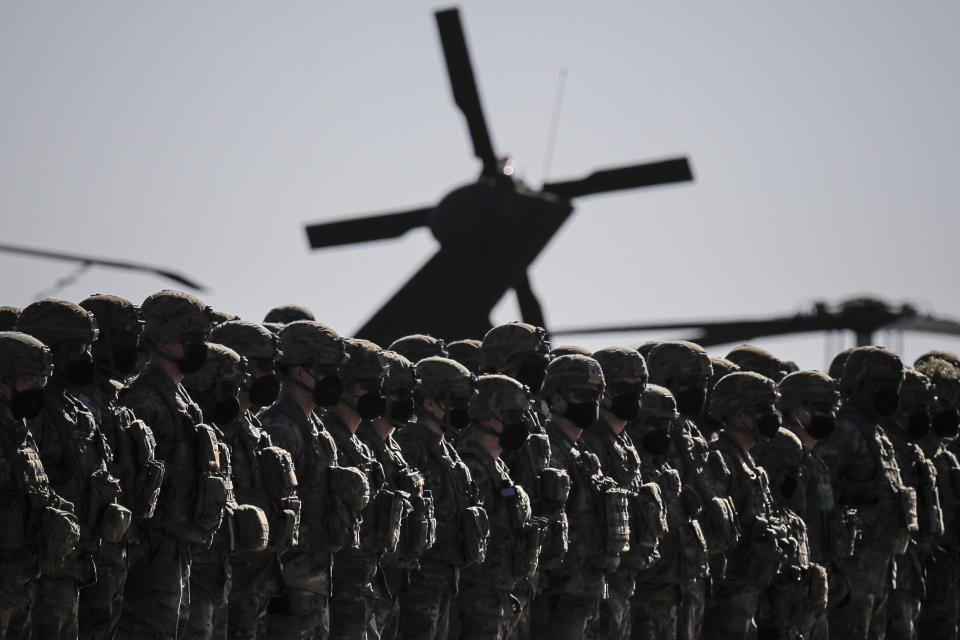 US soldiers line up during the visit of NATO Secretary General Jens Stoltenberg at the Mihail Kogalniceanu airbase as tensions rise between Russia and Ukraine.