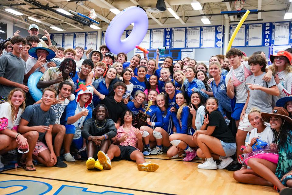 Students pose with the Barron Collier Cougars team after winning the CCAC championship over the Gulf Coast Sharks on Thursday, Oct. 5, 2023.