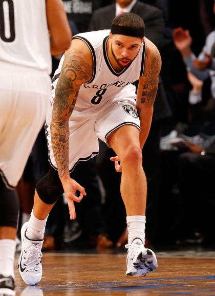 BROOKLYN, NJ - APRIL 27: Deron Williams #8 of the Brooklyn Nets reacts after a three point basket in the second half against the Atlanta Hawks during game four in the first round of the 2015 NBA Playoffs at Barclays Center on April 27, 2015 in the Brooklyn borough of New York City. NOTE TO USER: User expressly acknowledges and agrees that, by downloading and/or using this photograph, user is consenting to the terms and conditions of the Getty Images License Agreement. (Photo by Jim McIsaac/Getty Images)